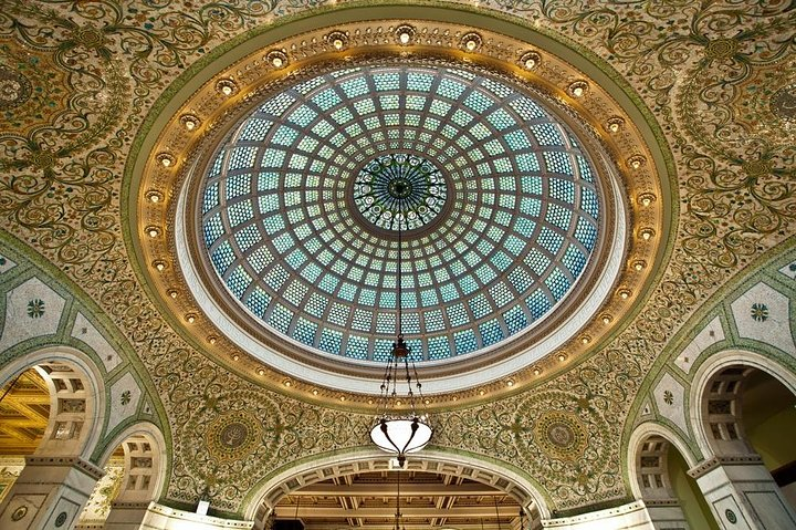 Explore stunning art-glass masterpieces under a magnificent dome revealing the elegance of Tiffany's craftsmanship. Discover Chicago's rich artistic legacy while immersing in historical beauty and architectural charm.